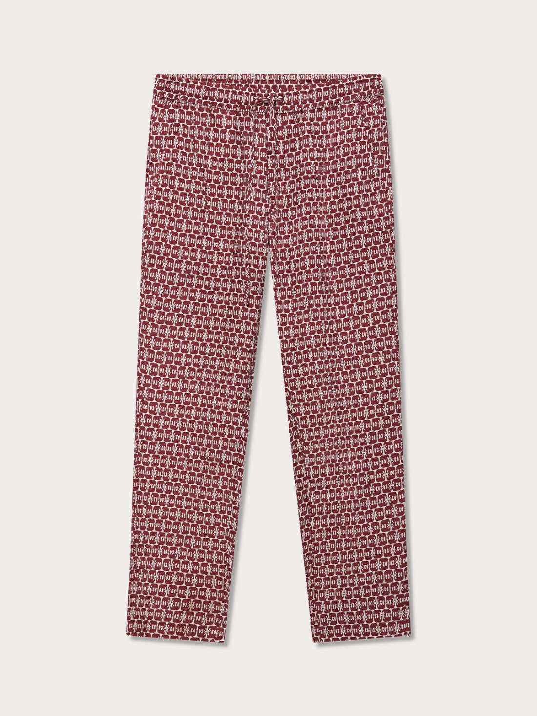 Elephant trousers men with drawstring waist and elephant print motif in red and white. Burgundy mens linen trousers front view with 2 front pockets.