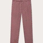 Elephant trousers men with drawstring waist and elephant print motif in red and white. Burgundy mens linen trousers front view with 2 front pockets.