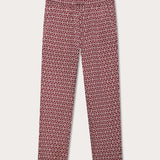 Elephant trousers men with drawstring waist and elephant print motif in red and white. Burgundy mens linen trousers front view with 2 front pockets.