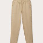 Front view of Men's Coconut Eleuthera Linen Trousers. Beige linen pants for men with 2 front pockets, drawstring tie and elastic waist.