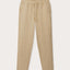 Front view of Men's Coconut Eleuthera Linen Trousers. Beige linen pants for men with 2 front pockets, drawstring tie and elastic waist.