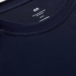 Close-up of mens navy blue rash vest with classic rounded collar and long sleeves.