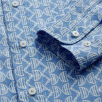 Close-up cuff view of Men's Kissing Fish Abaco Linen Shirt. Blue and white shirt with fish design.