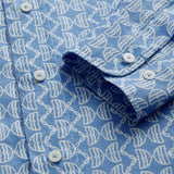 Close-up cuff view of Men's Kissing Fish Abaco Linen Shirt. Blue and white shirt with fish design.