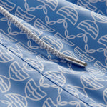 Detailed view of Men's Kissing Fish Staniel Swim Shorts showing white kissing fish on a blue base.