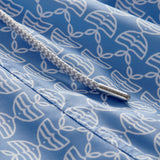 Detailed view of Men's Kissing Fish Staniel Swim Shorts showing white kissing fish on a blue base. 