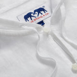 Close-up of Men's White Windermere Linen Long Sleeve Hoodie. Long-sleeved half-button-up 100% linen hoodie. 2 front pockets with a drawstring hood.