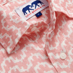 Close-up of Men's Elephant Palace Strawberry Abaco Linen Shirt. White and pink linen shirt featuring bestselling elephant palace print. Long-sleeved, button-up shirt in a relaxed fit.