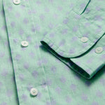 Close-up of Men's Palm Days Abaco Linen Shirt cuff. Green and blue mens linen shirt. Long-sleeved, button-up shirt with classic collar.