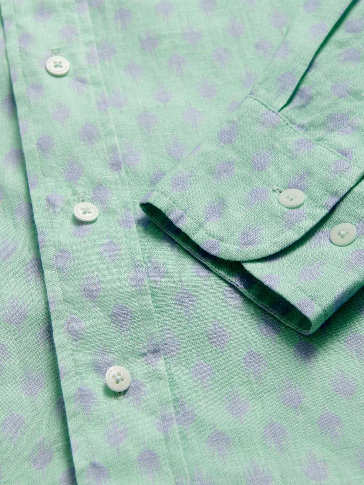 Close-up of Men's Palm Days Abaco Linen Shirt cuff. Green and blue mens linen shirt. Long-sleeved, button-up shirt with classic collar.