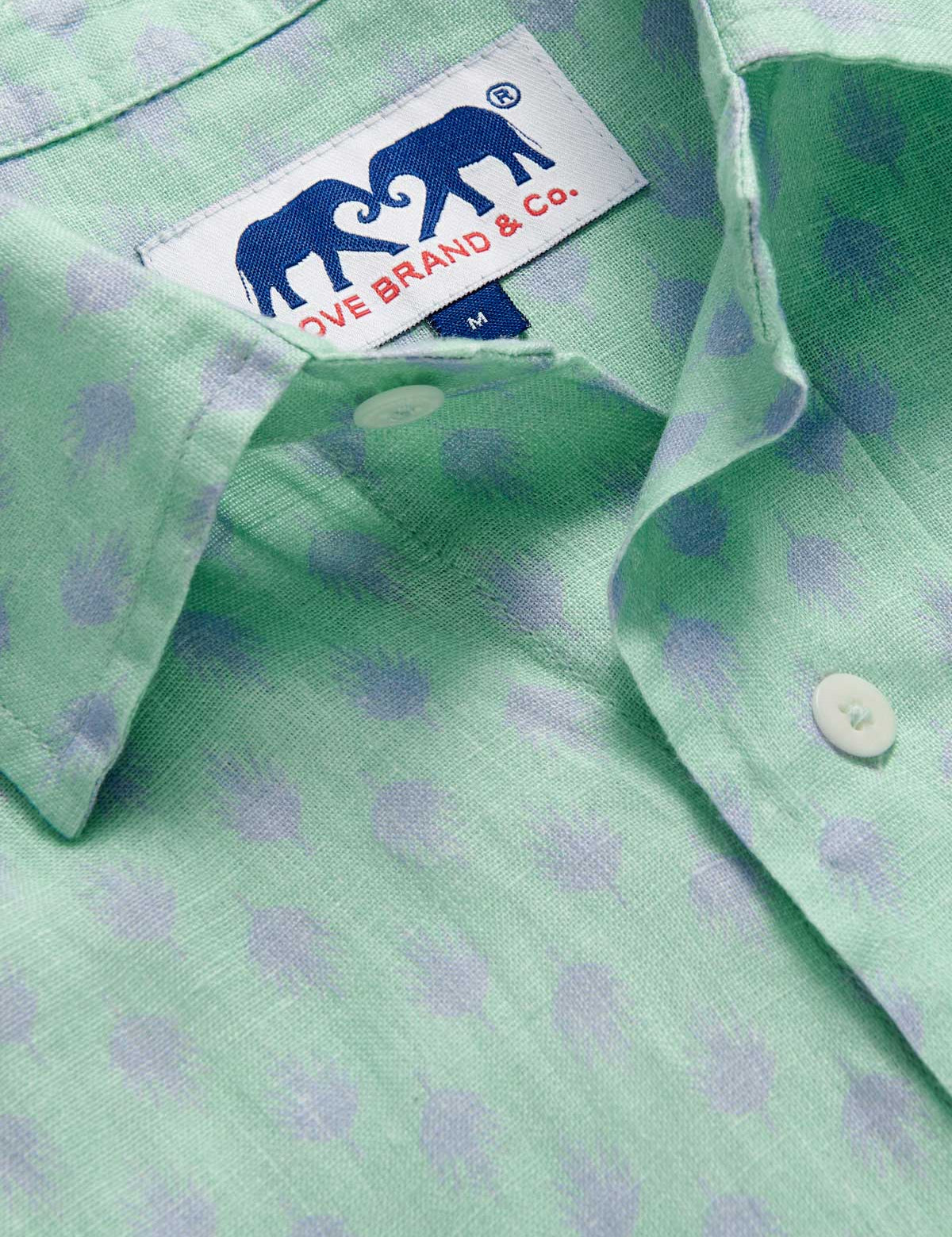 Close-up of Men's Palm Days Abaco Linen Shirt collar. Green and blue mens linen shirt. Long-sleeved, button-up shirt with classic collar.