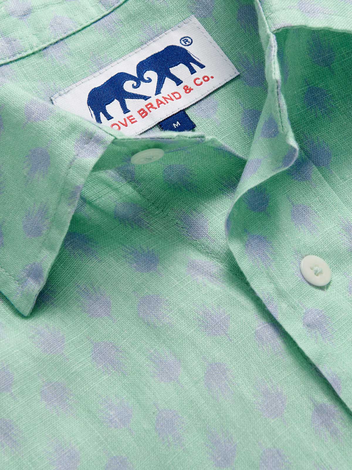 Close-up of Men's Palm Days Abaco Linen Shirt collar. Green and blue mens linen shirt. Long-sleeved, button-up shirt with classic collar.