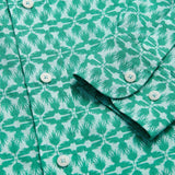 Men's Palm Eagle Abaco Linen Shirt close-up featuring tropical palm leaf and eagle pattern in green and white. Old money shirts made from 100% linen.