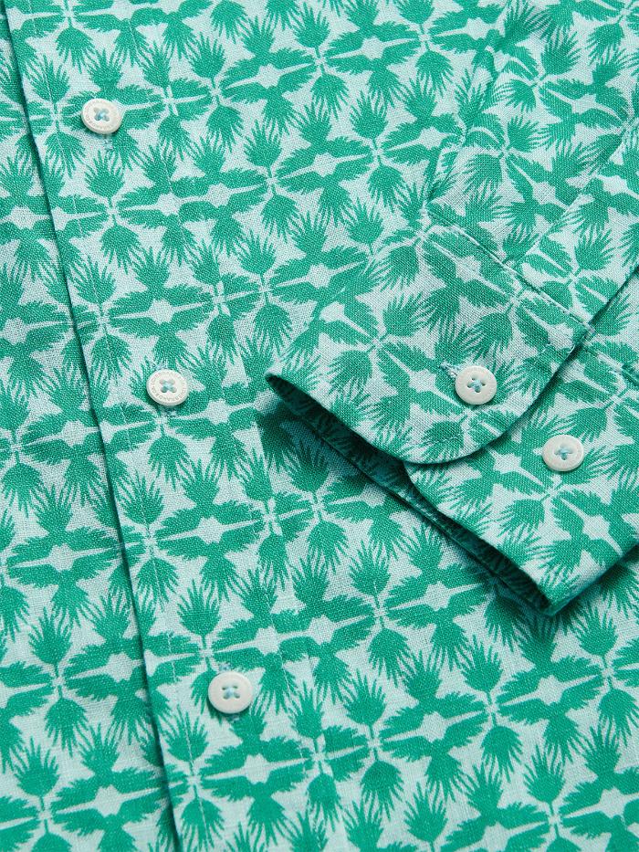 Men's Palm Eagle Abaco Linen Shirt close-up featuring tropical palm leaf and eagle pattern in green and white. Old money shirts made from 100% linen.