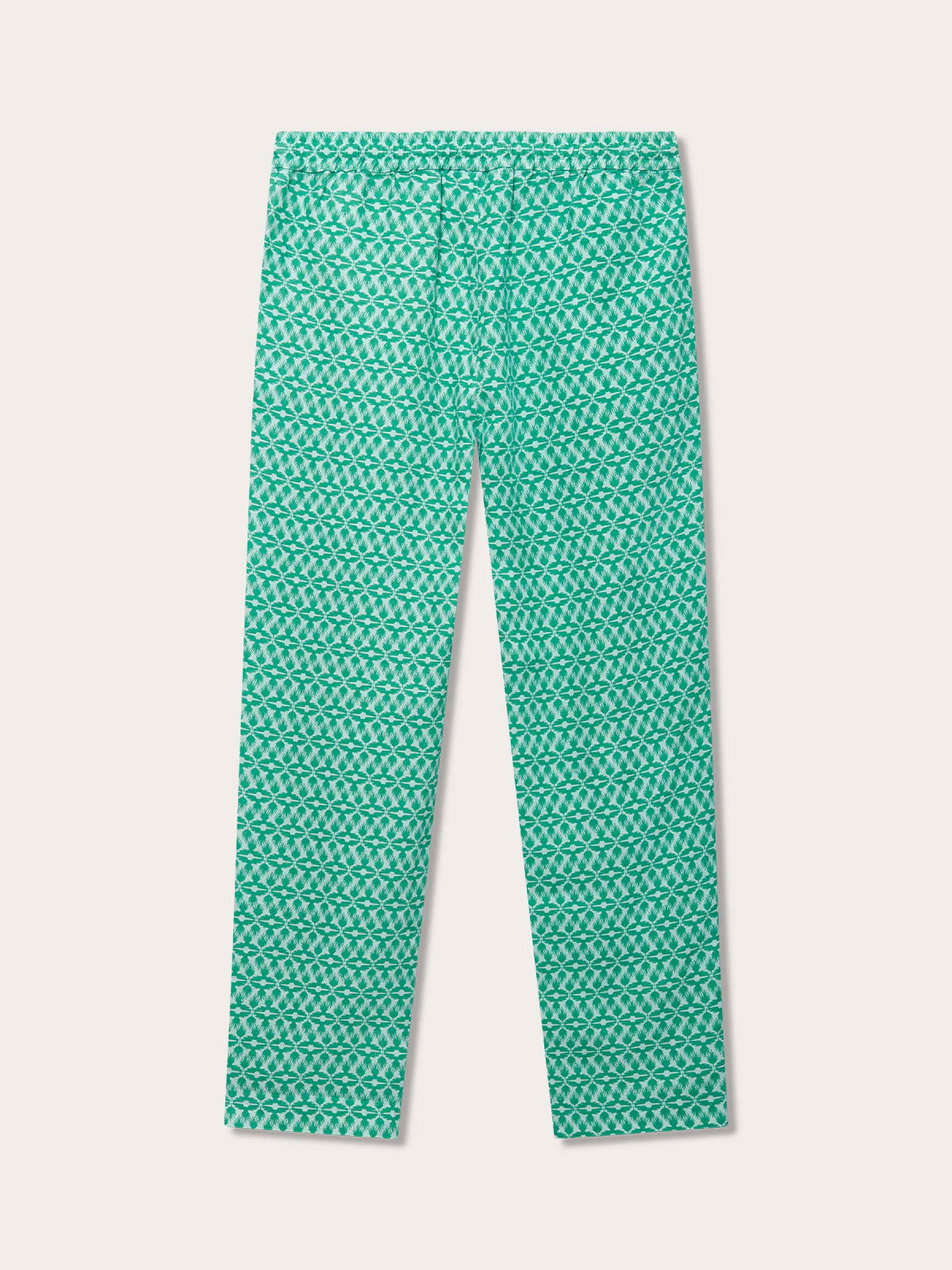 mens green linen trousers with a distinctive pattern inspired by the Lesser Fish Eagle of India and tropical palms. Back view of mens linen trousers perfect for old money styling.