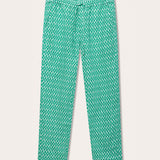 Front view of Men's Palm Eagle Eleuthera Linen Trousers. Green linen trousers mens with a pattern inspired by the Lesser Fish Eagle and tropical palms.