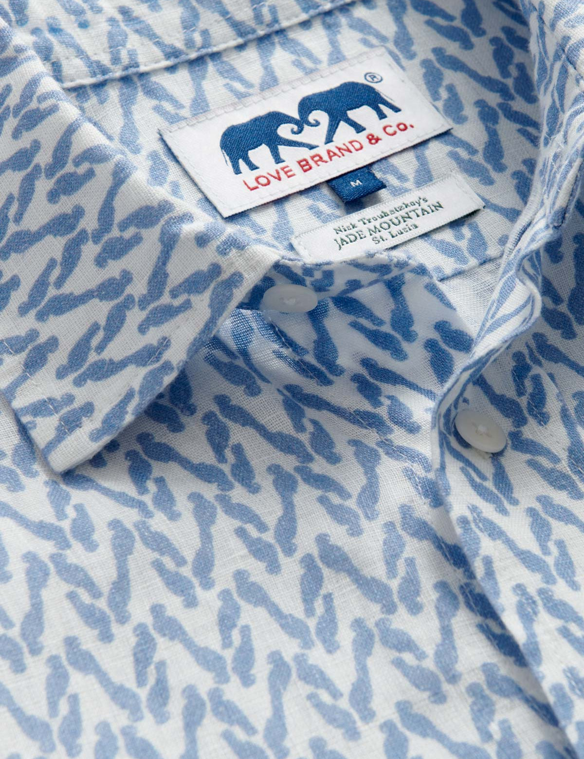 Men's Parrot Paradise Abaco Linen Shirt by LOVE BRAND & Co. Blue and white long-sleeved mens linen shirt with button up design.