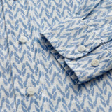 Close-up cuff view of Men's Parrot Paradise Abaco Linen Shirt. Blue and white mens linen shirt with a parrot pattern.