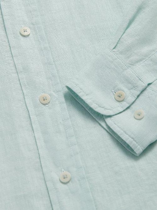 Close-up of Sea Air Abaco men's Linen Shirt in pastel hue showing buttons and sleeve details.