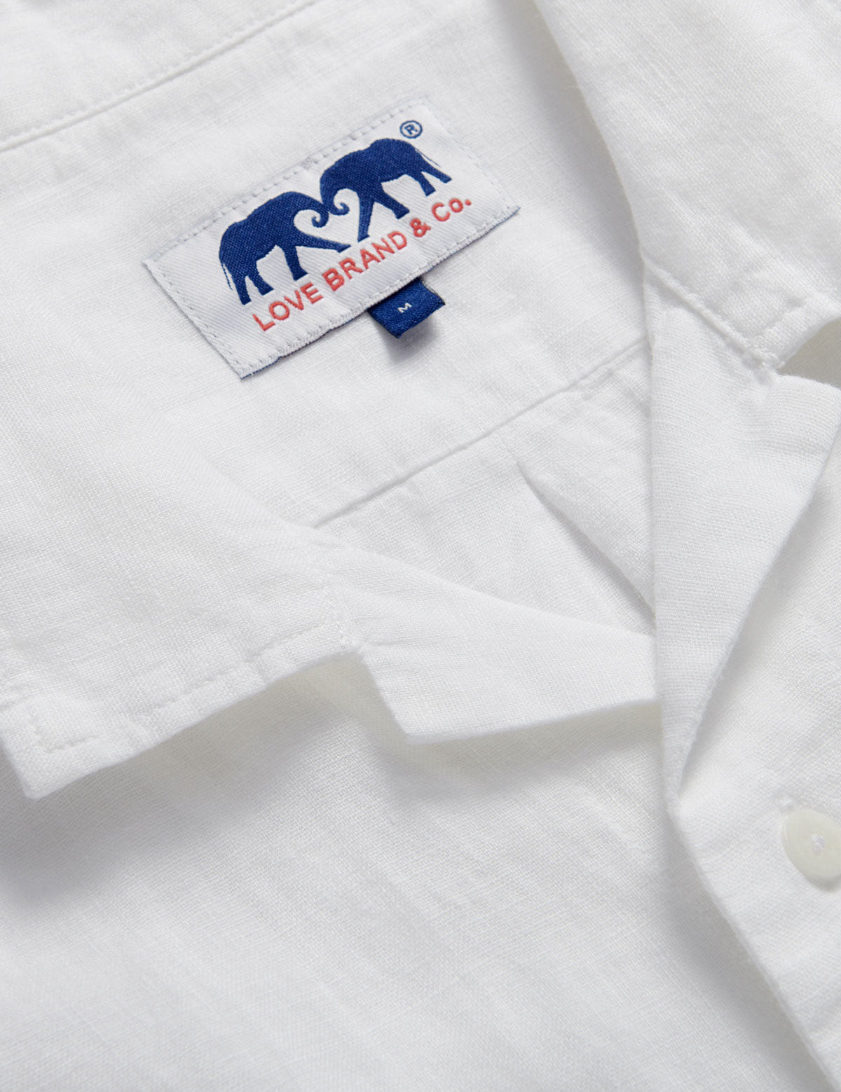 Men's White Normans Linen Shirt. Short sleeved mens linen shirt with camp collar and two double breast pockets.