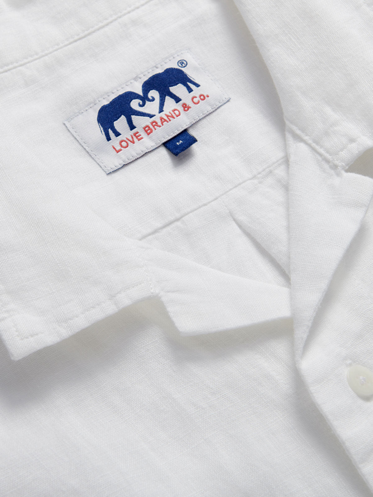 Men's White Normans Linen Shirt. Short sleeved mens linen shirt with camp collar and two double breast pockets.