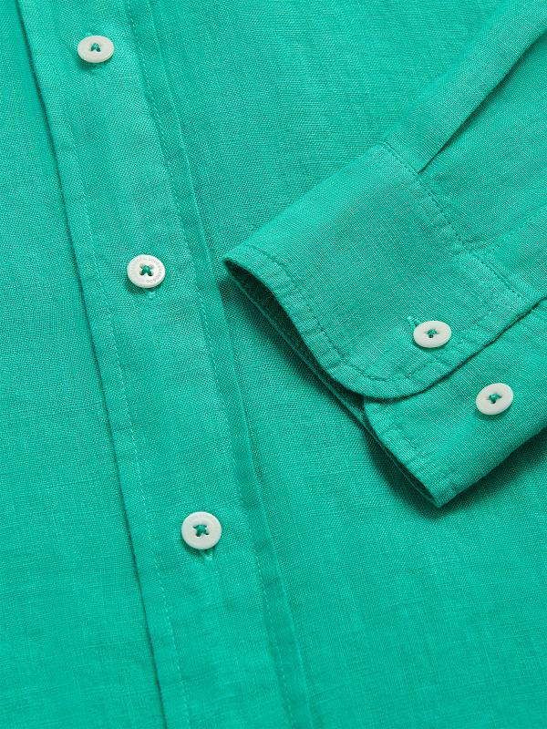 Men's Sicilian Green Abaco Linen Shirt with white buttons, close-up view showing fabric texture and sleeve detail, 100% linen material for comfort and breathability.