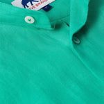 Close-up view of the Men's Palm Eagle Maycock Linen Shirt in vibrant green showcasing button details. Old money shirts made from 100% linen.