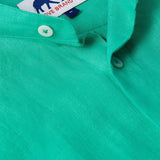 Close-up view of the Men's Palm Eagle Maycock Linen Shirt in vibrant green showcasing button details. Old money shirts made from 100% linen.