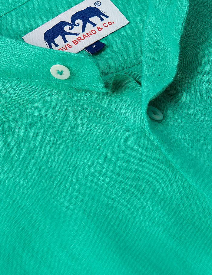 Close-up view of the Men's Palm Eagle Maycock Linen Shirt in vibrant green showcasing button details. Old money shirts made from 100% linen.