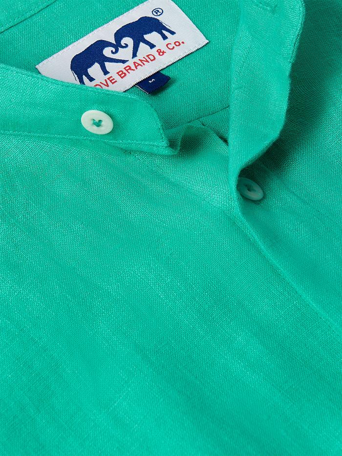 Close-up view of the Men's Palm Eagle Maycock Linen Shirt in vibrant green showcasing button details. Old money shirts made from 100% linen.