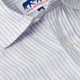 Close-up view of Men's Sky Lines Abaco Linen Shirt with sky blue thin lines on a white base.