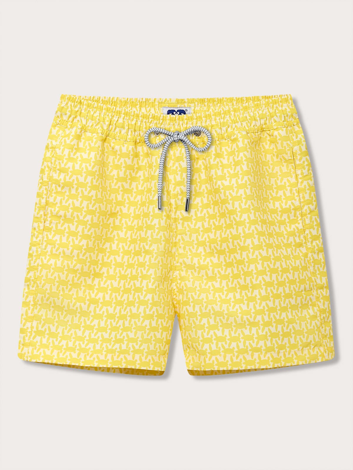 Men's Turtle Light Staniel Swim Shorts featuring a vibrant yellow pattern inspired by baby turtles. Patterned swim short highlighting the turtle nesting season and conservation efforts, with an elastic waistband and drawstring.