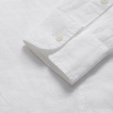 Detailed view of the cuffs of Men's White Windermere Linen Long Sleeve Hoodie. Long-sleeved half-button-up 100% linen hoodie. 2 front pockets with a drawstring hood.