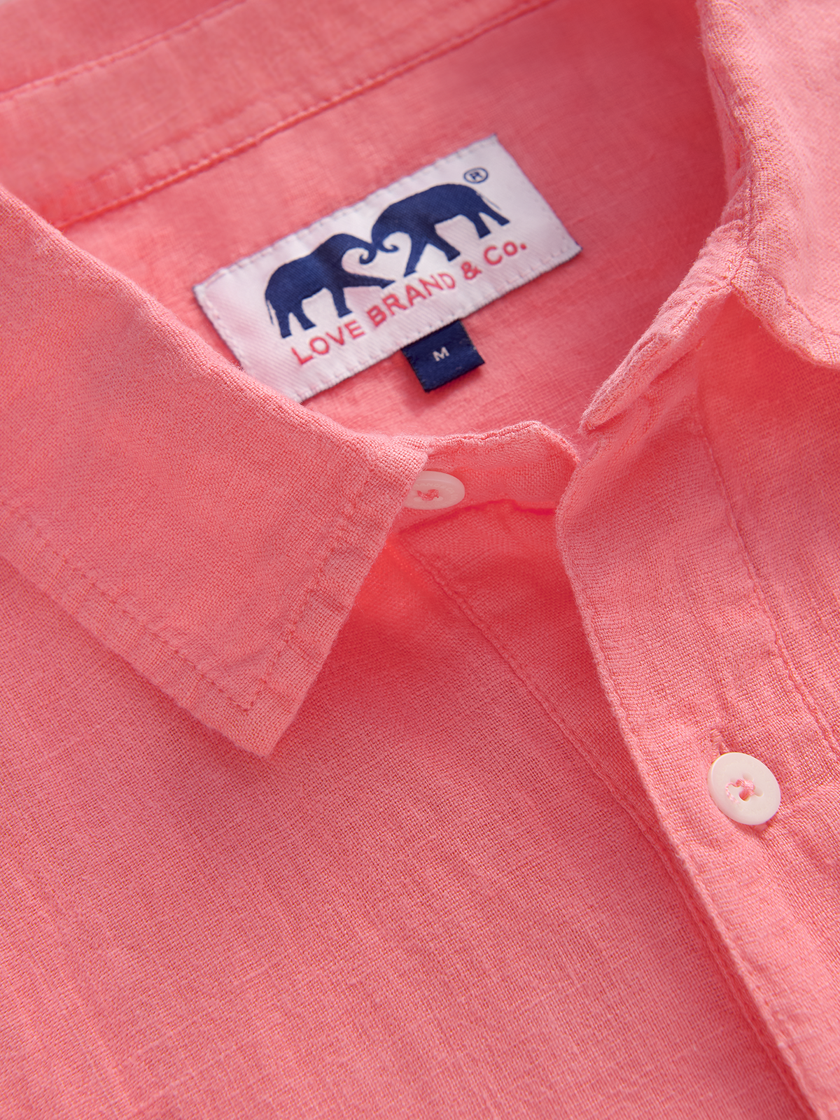 collar view of a men's pink linen shirt