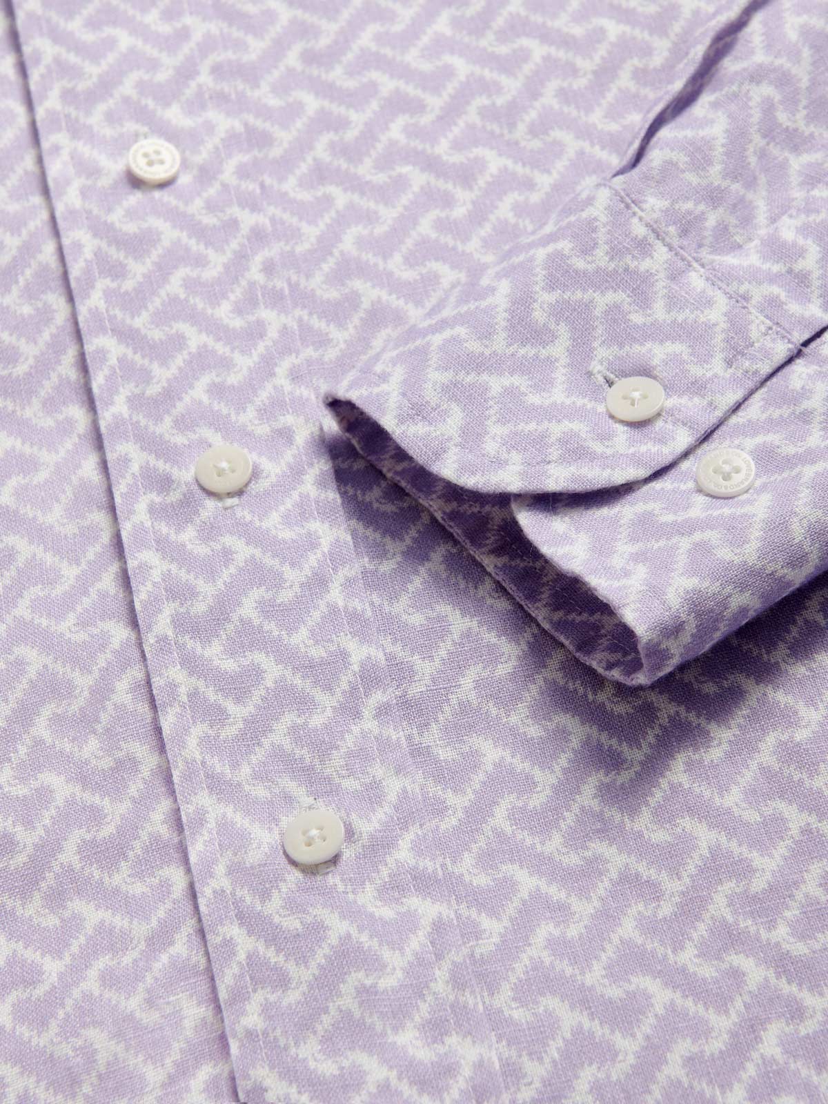 Detailed view of Men's Crazy Maze Abaco Linen Shirt. Long-sleeved, button-up white and purple patterned linen shirt. 