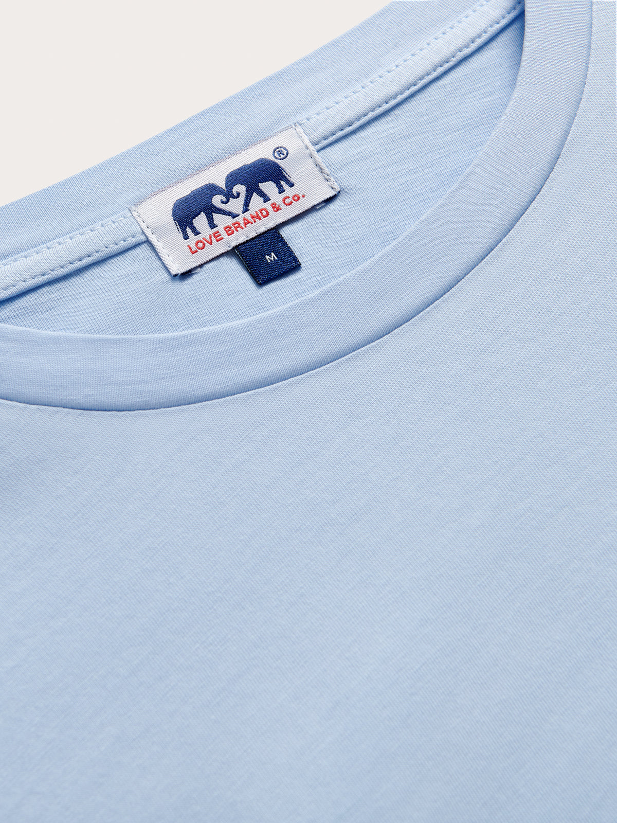 Light blue t-shirt with a brand label on the collar