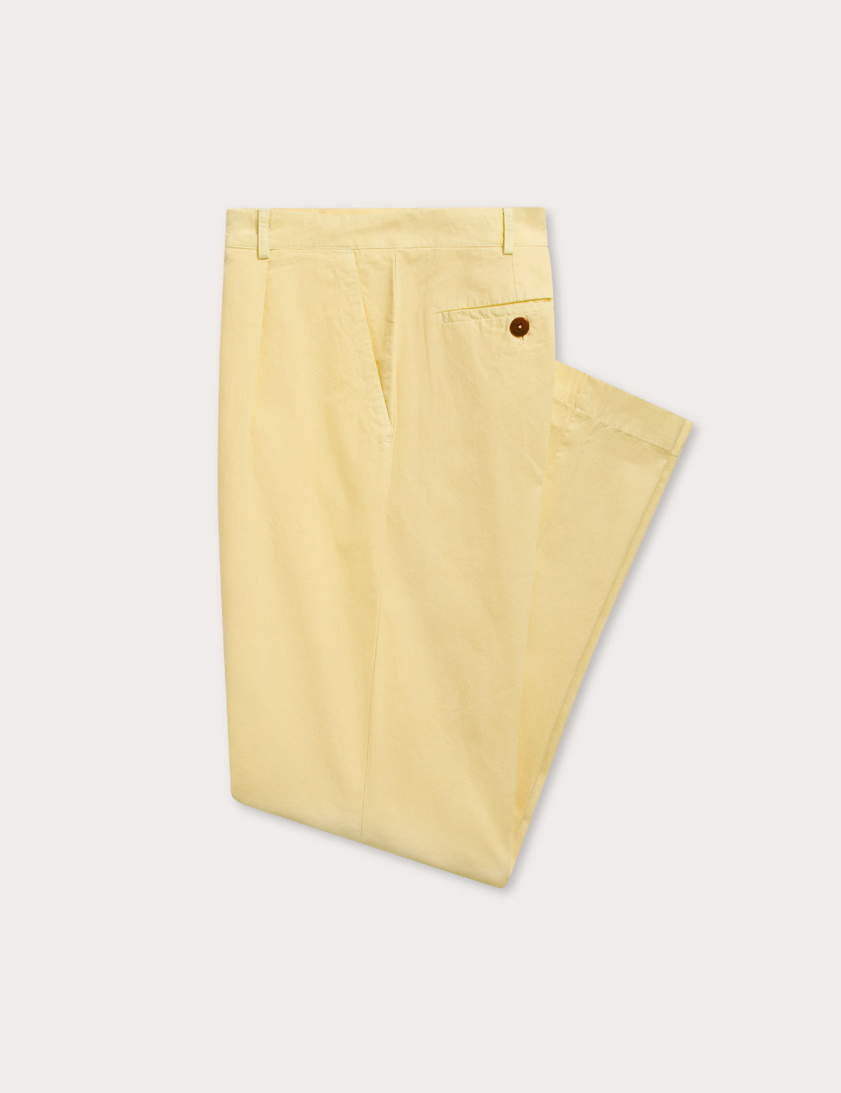 Side view of men's yellow chino trousers.