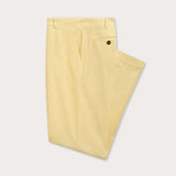 Side view of men's yellow chino trousers.