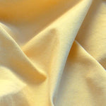 Close-up view of men's yellow shorts crafted from 100% cotton.