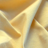 Close-up view of men's yellow shorts crafted from 100% cotton.