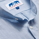 Close-up view of the Men's Elephant Palace Sky Maycock Linen Shirt showcasing the collar, buttons, and the Love Brand & Co. label with an elephant design.