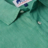 Men's Riviera Green Abaco Linen Shirt close-up showing collar, buttons, and Love Brand & Co. label. One of our old money shirts crafted from 100% linen.