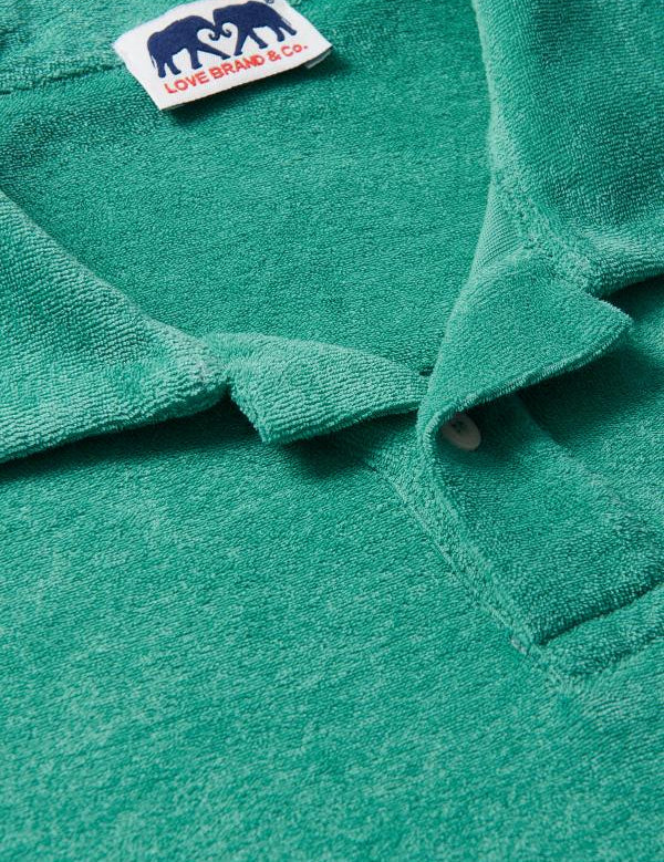 Close-up of Men's Riviera Green Powell Terry Polo shirt. Old money shirts showcasing lightweight terry towelling material.