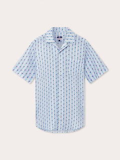 Men's Star Dancer Arawak Linen Shirt with pastel pink, limoncello, cay green, and deep blue sea star motif on ocean blue background.