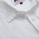 Close-up of Men's White Andros Hemp Shirt showing detailed stitching, a collar, and the "Love Brand & Co." label.