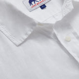 Close-up of Men's White Andros Hemp Shirt showing detailed stitching, a collar, and the "Love Brand & Co." label.