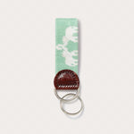 Love Brand green key chain featuring elephant palace needlepoint design. Green keyring made from genuine leather.