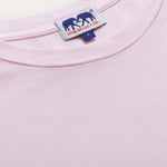 Close-up of Men's Pastel Pink Lockhart T-Shirt featuring soft, light power pink fabric and branded tag.