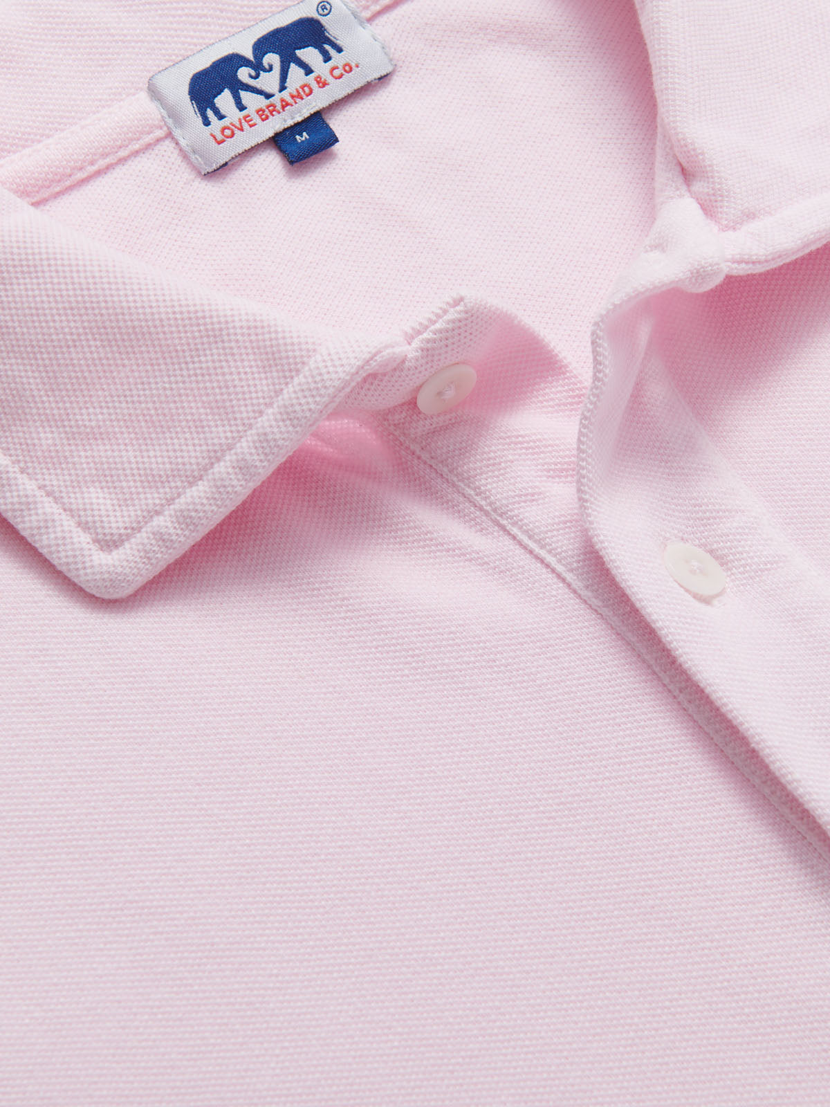 Pastel Pink Pensacola mens Polo Shirt with collar detail and buttons, featuring a soft and elegant light pink color.