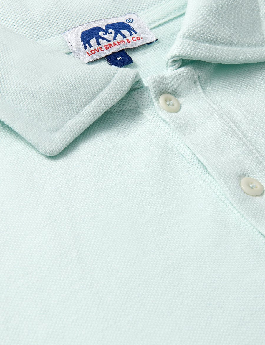 Close-up of the Men's Sea Air Pensacola Polo Shirt in pastel hue, featuring breathable cotton fabric and button details.